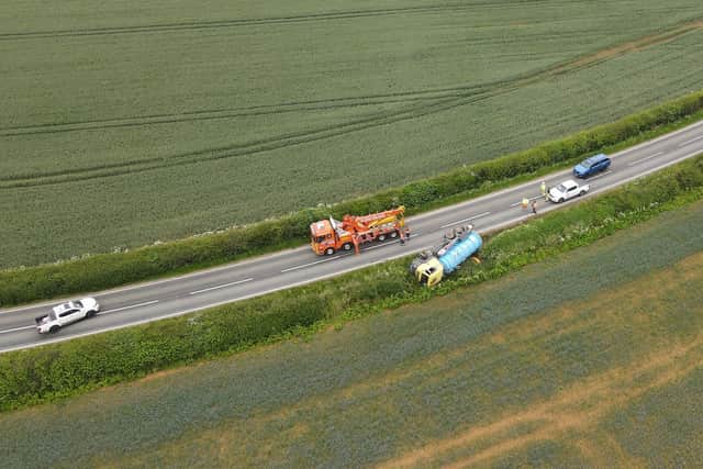 The recovery of the overturned lorry tanker begins, south of Digby on the B1188. Photo: John Siddle EMN-210625-110200001