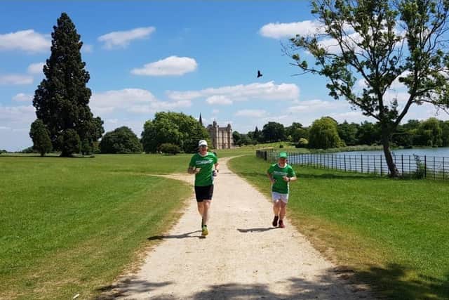 Nigel Johnson and Dean Marratty running through Lincolnshire's iconic scenery. EMN-210625-173628001