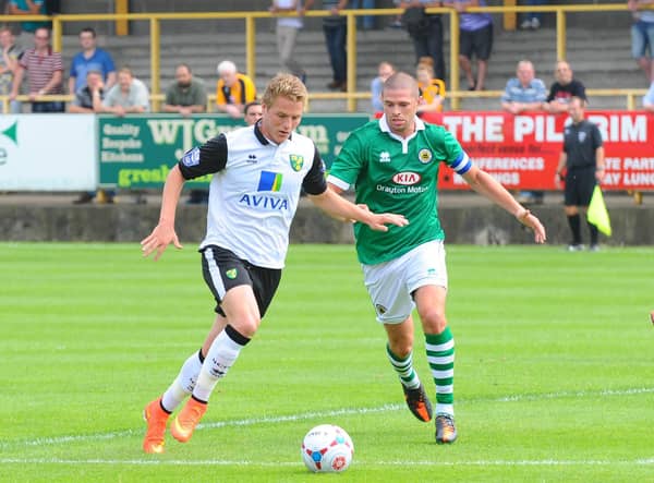 United defender Scott Garner in action against Norwich City the last time the two clubs met in a friendly, back in 2012.