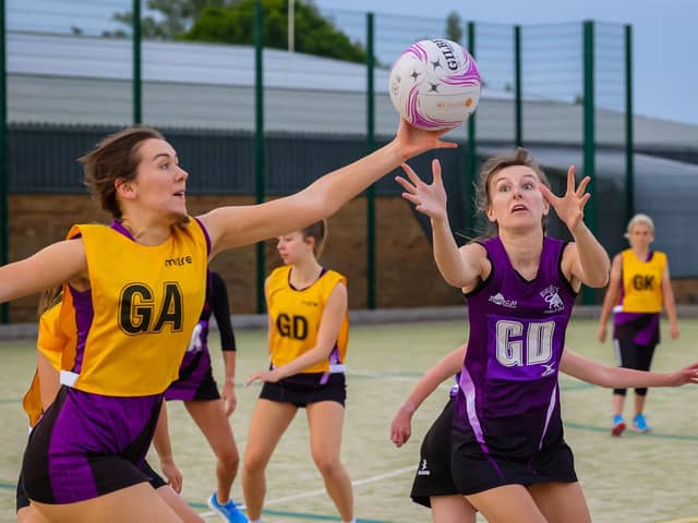 Netball action by David Dales.