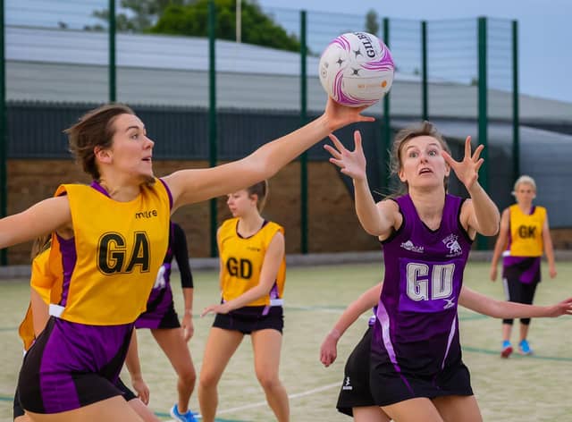 Netball action by David Dales.