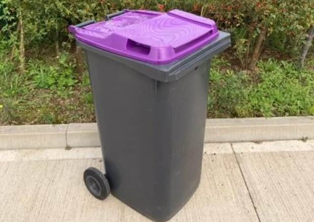 A purple-lidded bin like the ones that could be rolled out to all doorsteps in North Kesteven by September. EMN-210628-104158001