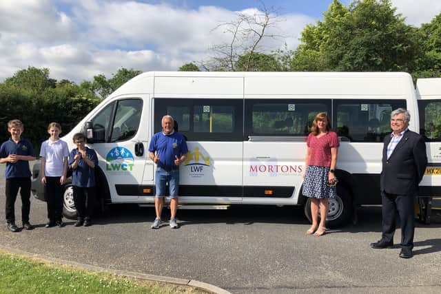 Pictured from left: pupils from St Lawrence School, Colin Trestrail, Kathryn Pinder and Philip Sharpe. EMN-210624-122745001