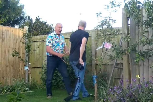 Councillor Matthews, pictured confronting Mr Ashwin.