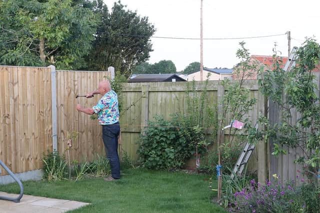 Councillor Mathews marking out the alleged land boundary.