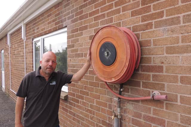 Martin Osborne - he kept the old hose reel on the side of the building as a knod to its former use. EMN-210207-170407001