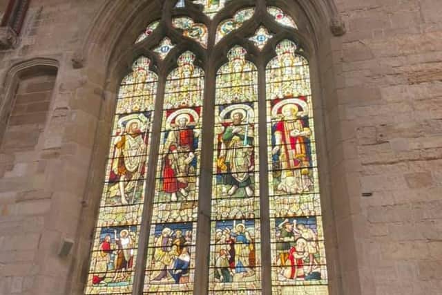 The historic window damaged by vandals