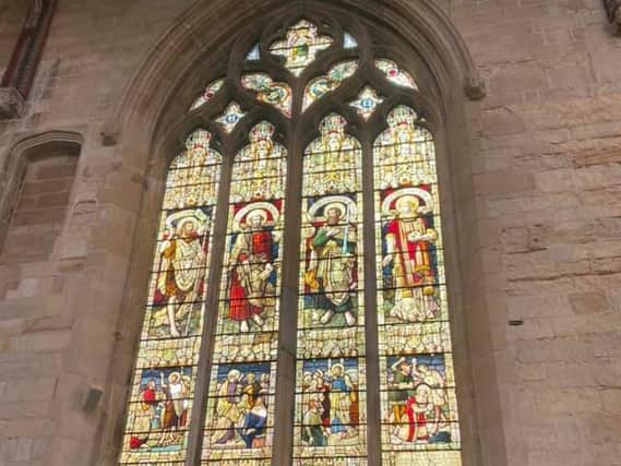 The historic window damaged by vandals