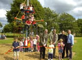 Coun Peter Bedford officially opening the new play equipment in Freiston 10 years ago. Pictured holding the ribbon (from left) are Charlie Fairman, seven, Gabriella Bedford, four, Cerys Horrey, seven. Pictured (back, from left) Coun Bedford, John Wright and Alistair Godwin, management committee for playing field association, and the Rev Andrew Higginson.