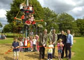 Coun Peter Bedford officially opening the new play equipment in Freiston 10 years ago. Pictured holding the ribbon (from left) are Charlie Fairman, seven, Gabriella Bedford, four, Cerys Horrey, seven. Pictured (back, from left) Coun Bedford, John Wright and Alistair Godwin, management committee for playing field association, and the Rev Andrew Higginson.