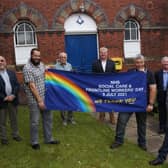 Members of Bayons Lodge with the banner outside the Jameson Bridge Street Masonic Hall EMN-210507-144735001