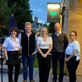 Kaleb Cooper and Charlie Ireland from Clarkson's Farm pictured with staff and owner Lesley Lonsdale (left) at The Bustard Inn in Rauceby. EMN-210607-124029001