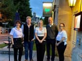 Kaleb Cooper and Charlie Ireland from Clarkson's Farm pictured with staff and owner Lesley Lonsdale (left) at The Bustard Inn in Rauceby. EMN-210607-124029001