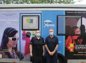 Staff members Emma Kew and Dean Bunch prepare to enter the Virtual Dementia Bus.
