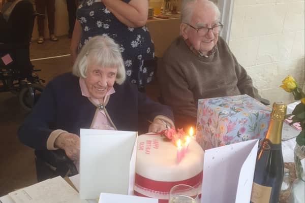 Olive Laxen enjoying her birthday tea with husband Eric, 99. EMN-211207-170912001