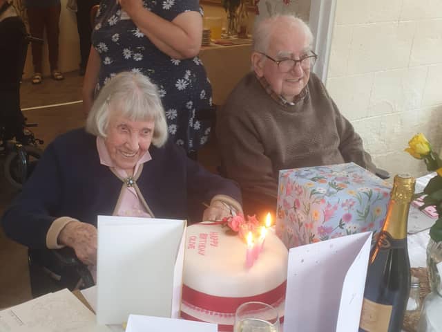 Olive Laxen enjoying her birthday tea with husband Eric, 99. EMN-211207-170912001