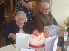 Olive Laxen enjoying her birthday tea with husband Eric, 99. EMN-211207-170912001