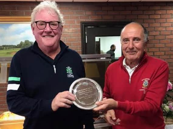 Brian Stone ( Radcliffe) presents the Friendship Trophy to Mike Thornton.