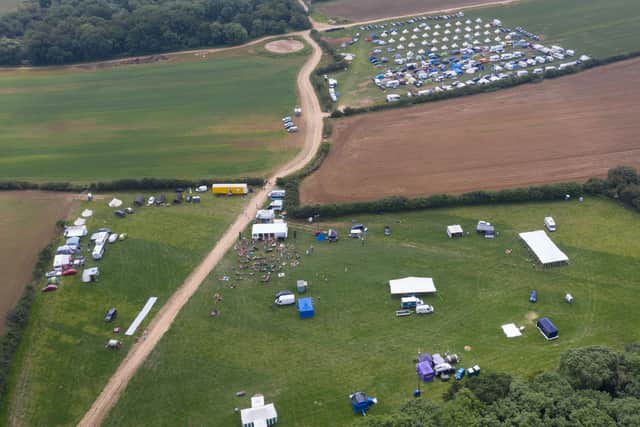 Around 200 happy campers arrived for adult bouncy castles, wet t-shirt competitions and a mobile dungeon. Photo: SWNS Jon Mills EMN-210707-144914001