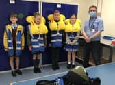 AEA (Aircrew Equipment Assemblies) Supervisor, Chris Wade (right) with pupils Lucas Frost, Ella Jenkins, Luke Papworth and Vania Rodriguez. Photo: Affinity Flying Services EMN-210807-114556001