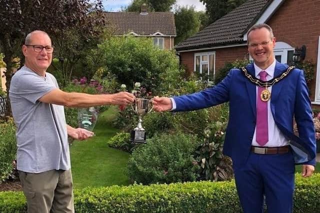 One of last year's winners, Harry Kerman, of Beck Way, pictured receiving his award from the Mayor of Louth, Councillor Darren Hobson.