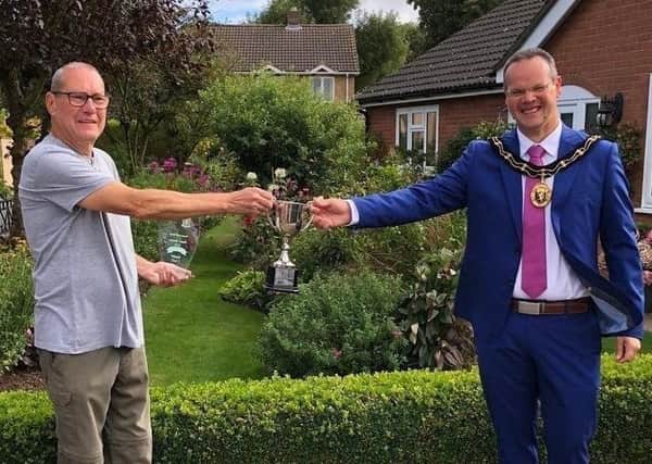 One of last year's winners, Harry Kerman, of Beck Way, pictured receiving his award from the Mayor of Louth, Councillor Darren Hobson.