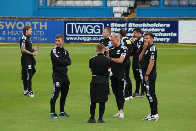 Butler, right, with his new teammates. Photo: Oliver Atkin