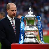 Prince William, Duke of Cambridge prepares to hand over the trophy after The Emirates FA Cup Final match between Chelsea and Leicester City at Wembley Stadium.. (Photo by Matt Childs - Pool/Getty Images)