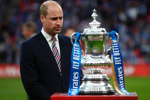Prince William, Duke of Cambridge prepares to hand over the trophy after The Emirates FA Cup Final match between Chelsea and Leicester City at Wembley Stadium.. (Photo by Matt Childs - Pool/Getty Images)