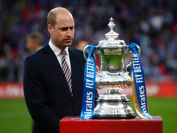 Prince William, Duke of Cambridge prepares to hand over the trophy after The Emirates FA Cup Final match between Chelsea and Leicester City at Wembley Stadium.. (Photo by Matt Childs - Pool/Getty Images)