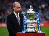Prince William, Duke of Cambridge prepares to hand over the trophy after The Emirates FA Cup Final match between Chelsea and Leicester City at Wembley Stadium.. (Photo by Matt Childs - Pool/Getty Images)