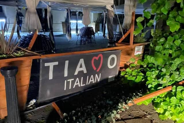 Wrecked trellis and planters outside Tiamo Italian restaurant in Sleaford market place after the England match. EMN-211207-133030001