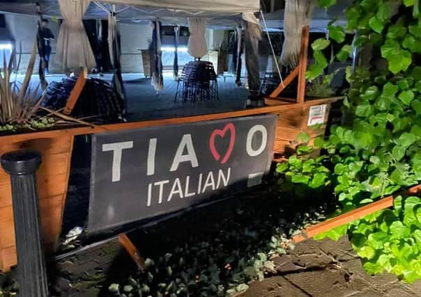 Wrecked trellis and planters outside Tiamo Italian restaurant in Sleaford market place after the England match. EMN-211207-133030001