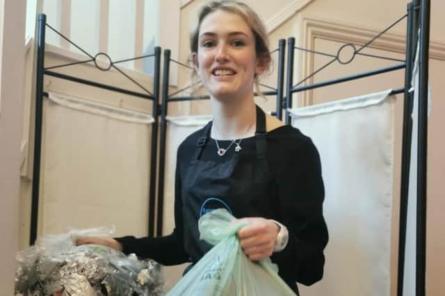 Heather McNeill, Expressions Senior Assistant Hairstylist boxing up recycling to send back to the Green Salon Collective. EMN-210907-145323001