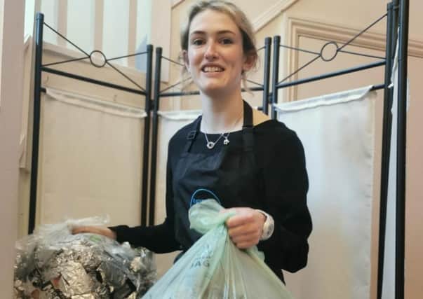 Heather McNeill, Expressions Senior Assistant Hairstylist boxing up recycling to send back to the Green Salon Collective. EMN-210907-145323001