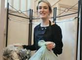 Heather McNeill, Expressions Senior Assistant Hairstylist boxing up recycling to send  back to the Green Salon Collective. EMN-210907-145323001
