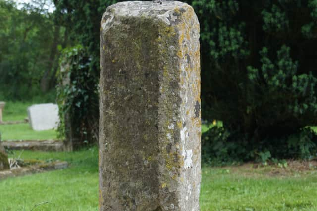 What remains of a medieval cross which has grade two status, with a quadrangular base and octagonal shaft. It is thought this cross may have been used as a meeting point or even place for worship for the village or travellers to the area. 
Photo by Dianne Tuckett  EMN-210713-134405001