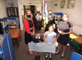 Receiving the ?15,000 towards the new library for Cranwell School. From left - PTA chairman Eleanor Ward, RBL chairman Major Clive Candlin, Standard bearer Brian Harvey, KS2 english leader Fiona Birchenall and pupils Finlay case, aged five, and Tilly Case, seven. EMN-210719-122613001