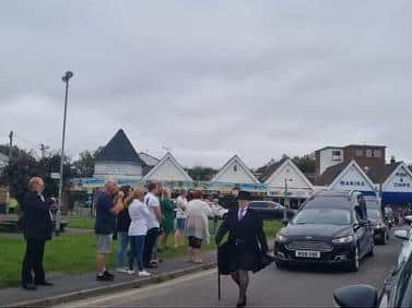 The funeral cortege at the Green at Chapel St Leonards on its way to Alford Crematorium.