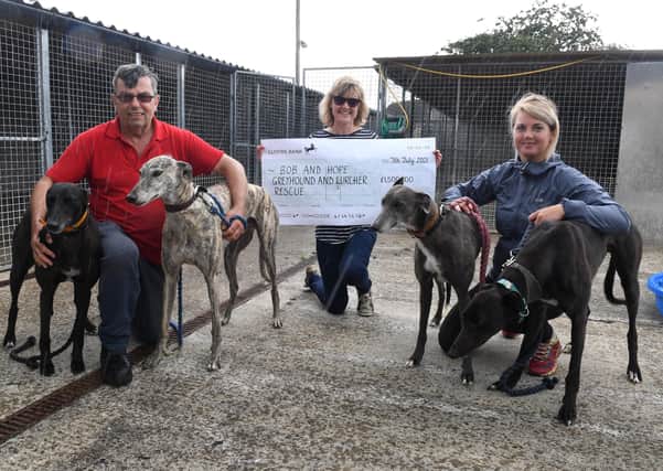 Sue Spencer of Helpringham raised ?1500 for the rescue centre in Fosdyke by walking 100 miles. L-R Vaughan Harman of Bob and Hope rescue centre, Sue Spencer and Santa Drozdova - volunteer. Pictured with rescue dogs L-R Jim, Billy, Noir and Mario. EMN-210807-094322001
