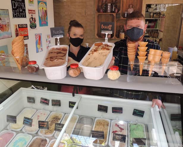 David Smith with staff member Ria Gourves at the Finch Miller Ice Cream shop. EMN-210719-180601001