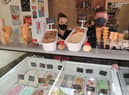 David Smith with staff member Ria Gourves at the Finch Miller Ice Cream shop. EMN-210719-180601001