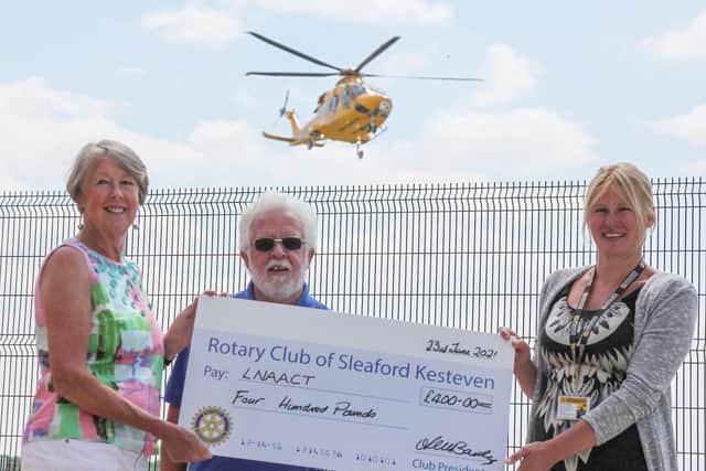President Angela Bailey is pictured with Rotarian Keith Austen giving the ?400 cheque to Kelly Geoghegan, the Fundraising Events Co-Ordinator for the LNAACT. EMN-210907-145301001