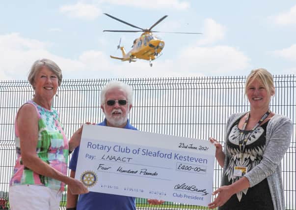 President Angela Bailey is pictured with Rotarian Keith Austen giving the ?400 cheque to Kelly Geoghegan, the Fundraising Events Co-Ordinator for the LNAACT. EMN-210907-145301001