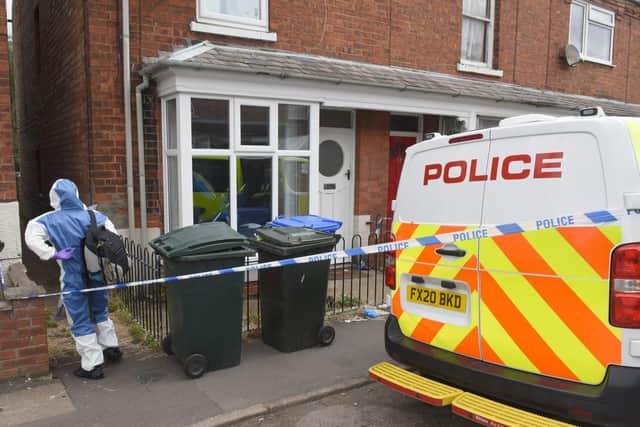 Officers remain at the murder probe scene