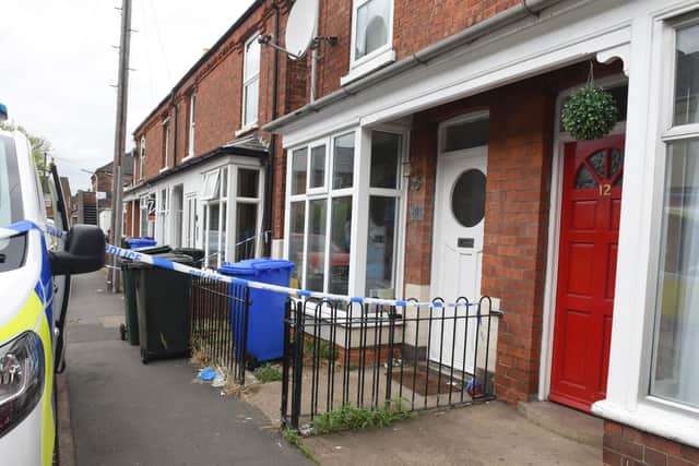 Officers remain at the murder probe scene