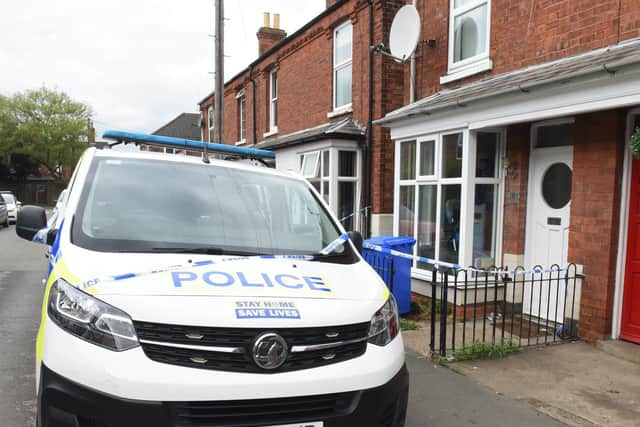 Officers remain at the murder probe scene