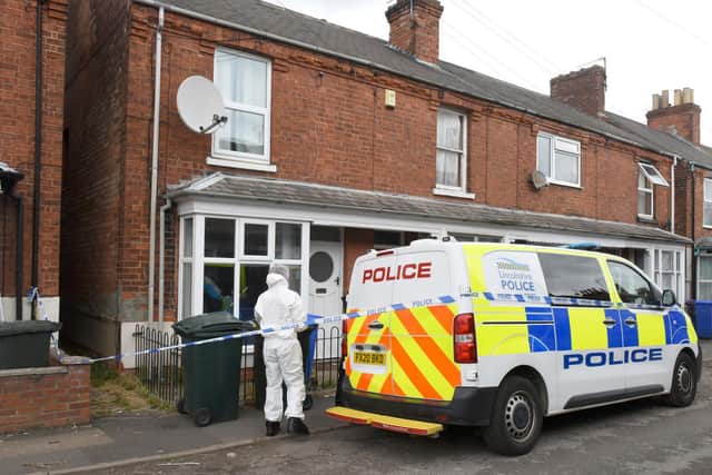 Police at the scene of the man's death yesterday