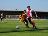 Fraser Preston battles for the ball in the friendly against Lincoln City. Photo: Oliver Atkin