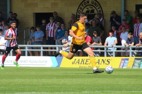Scott Duxbury in action against Lincoln City. Photo: Oliver Atkin